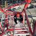Emergency rescue technician Erik Marshal climbs a crane ladder to simulate a rescue mission on Sunday. Daniel Brenner I AnnArbor.com